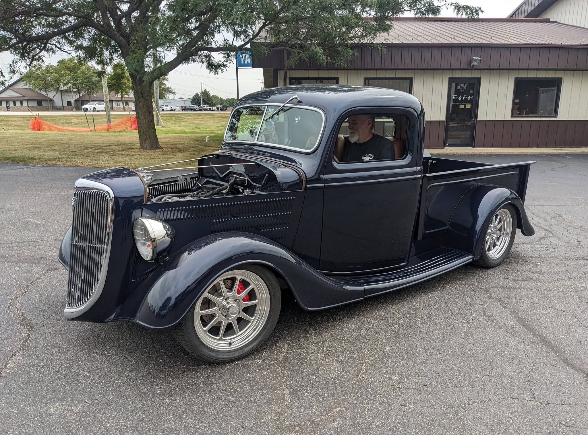 Vintage hot rod pickup outside the shop