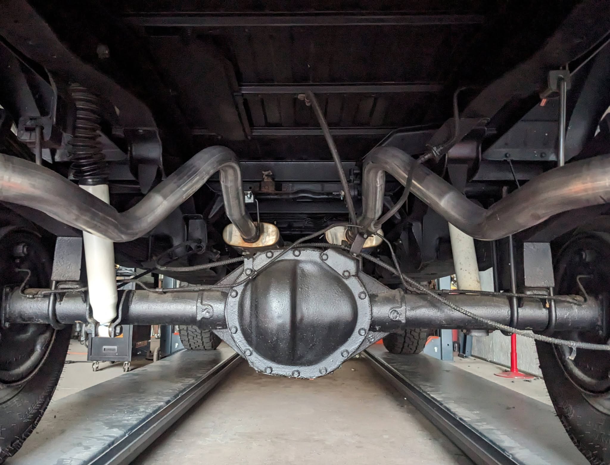 Fabricated exhaust over a rear axle