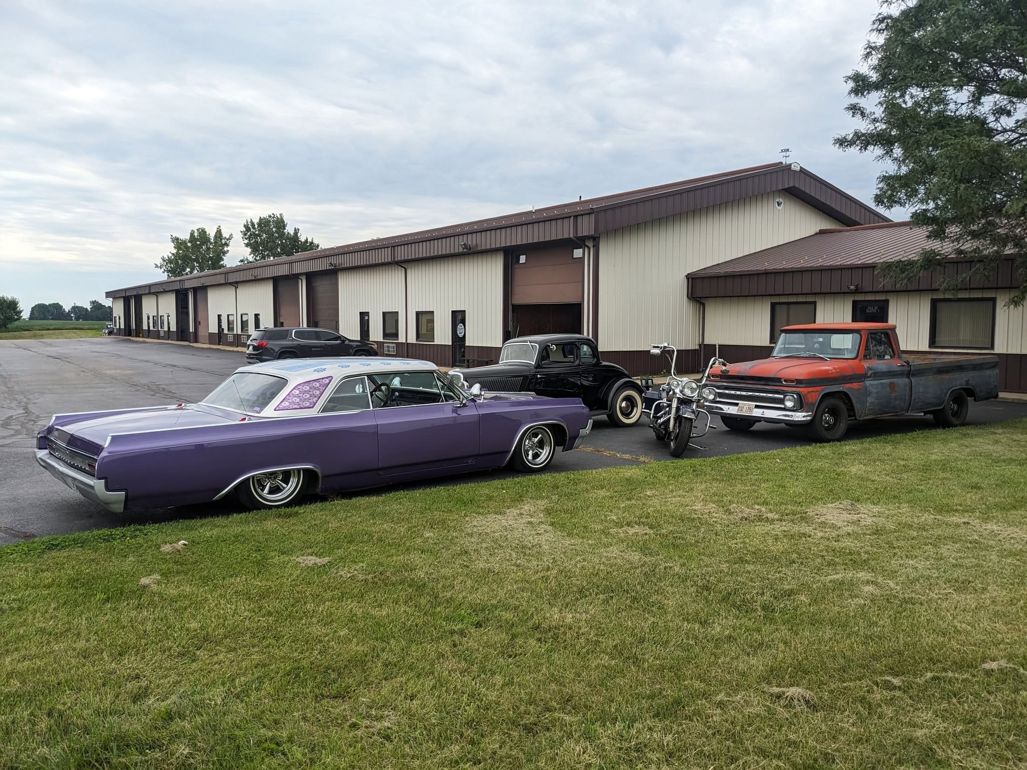 The shop on Lincoln Highway with customer cars out front
